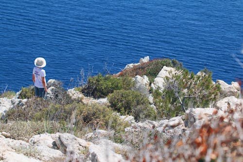 Tourist Looking at Blue Sea