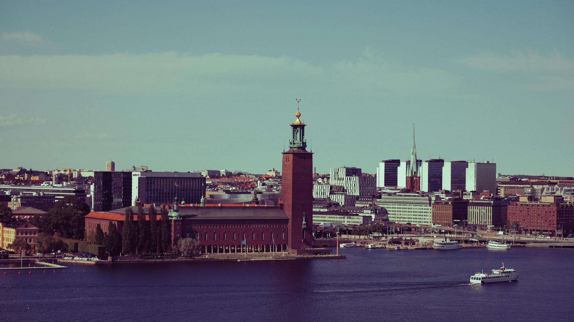 A beautiful cityscape of Stockholm featuring City Hall and waterfront views, perfect for travel and urban themes.