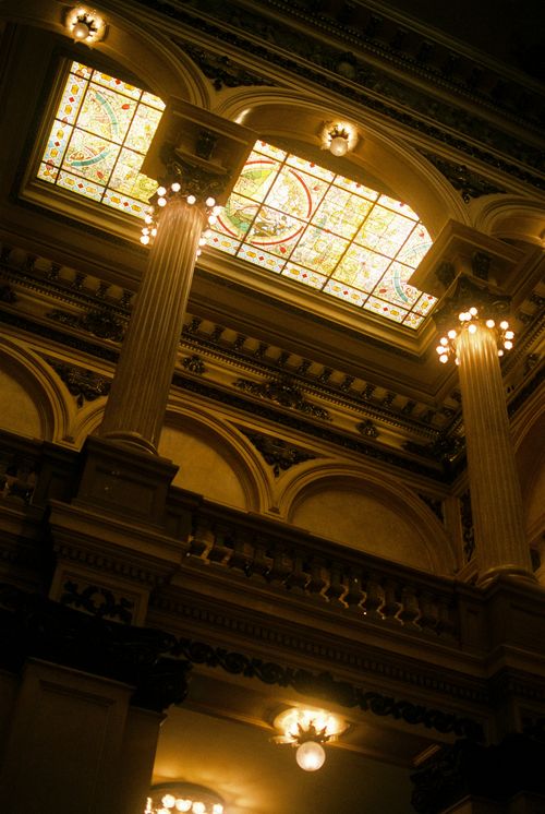 Free Low angle view of ornate columns and stained glass in Teatro Colón, Buenos Aires. Stock Photo