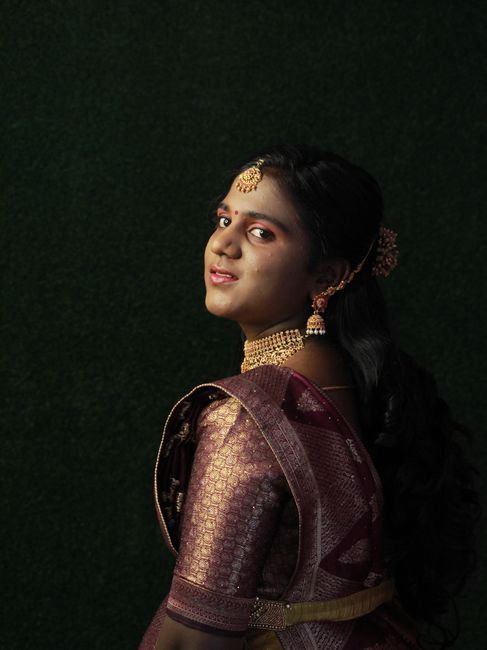 A captivating portrait of a woman in traditional attire with intricate jewelry.