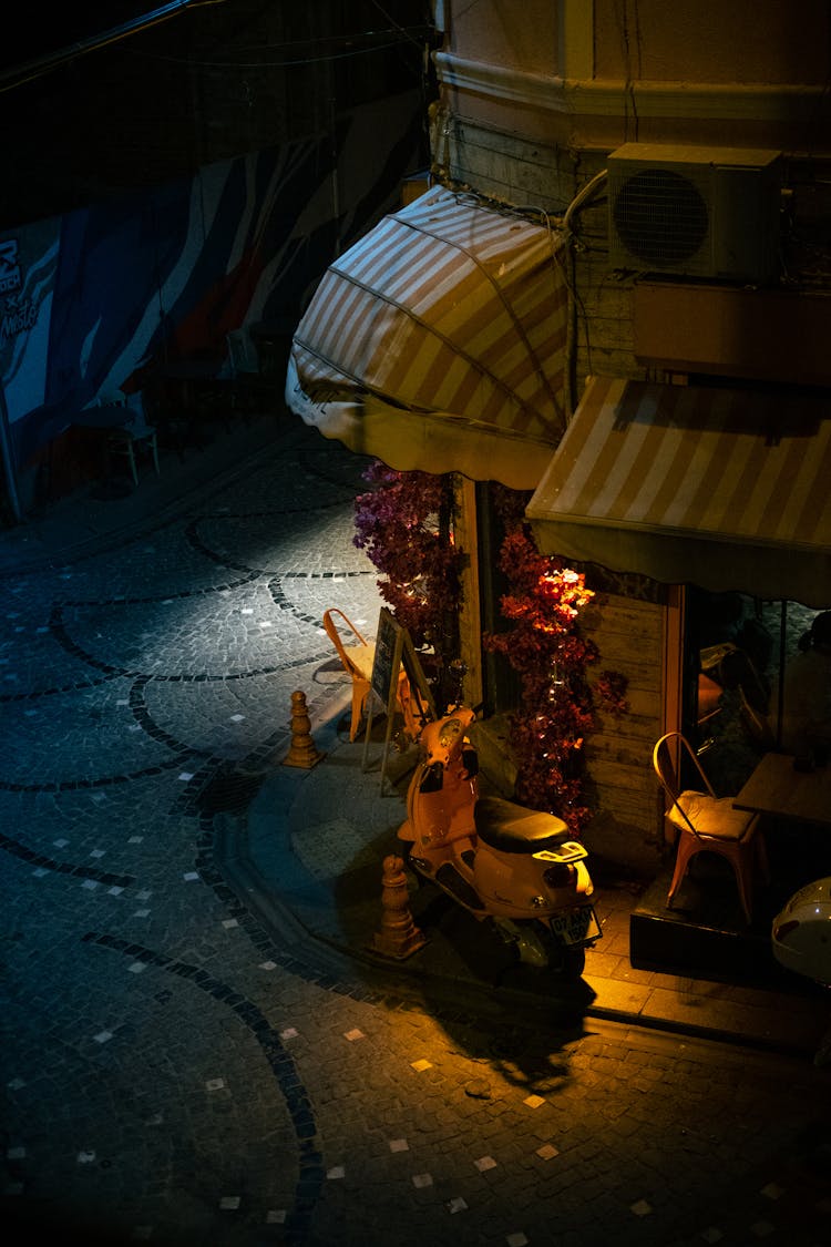 High Angle Shot Of Exterior Of A Restaurant In City In The Evening 