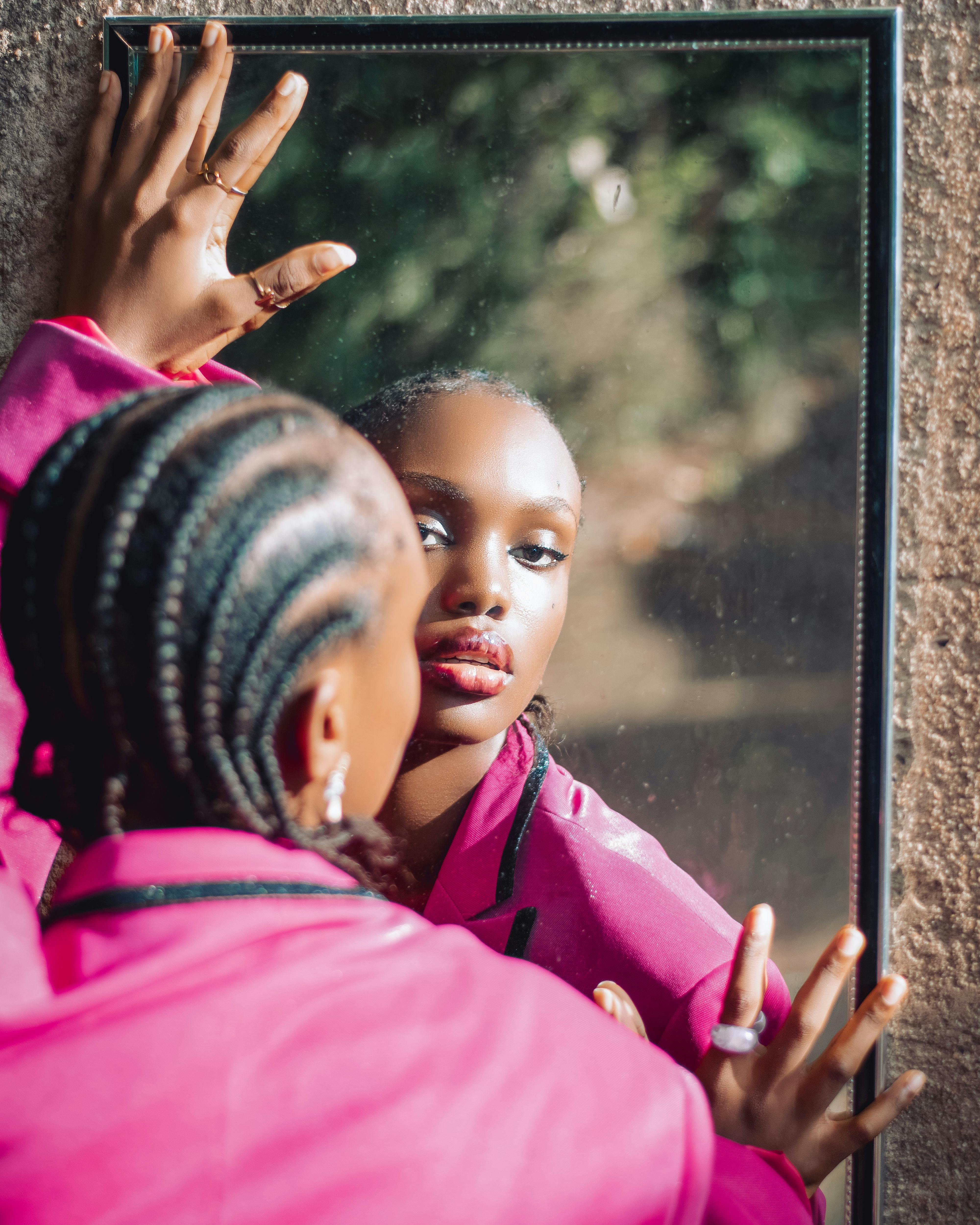 woman holding mirror reflection