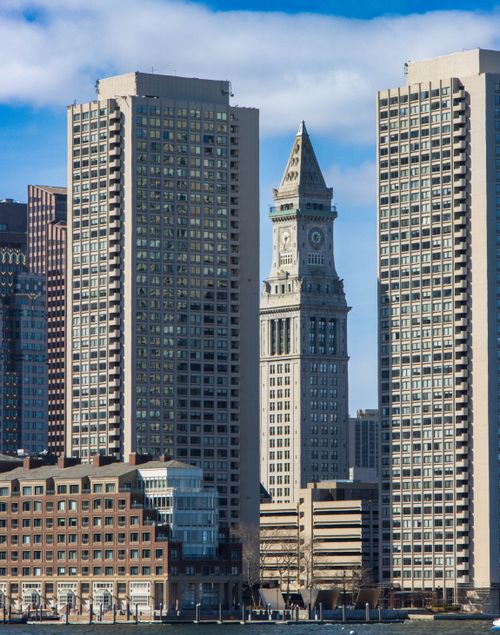 Free Iconic Boston skyline with Custom House Tower and skyscrapers under blue sky. Stock Photo
