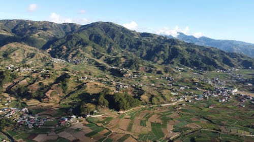 Fields and Hills around Village in Countryside