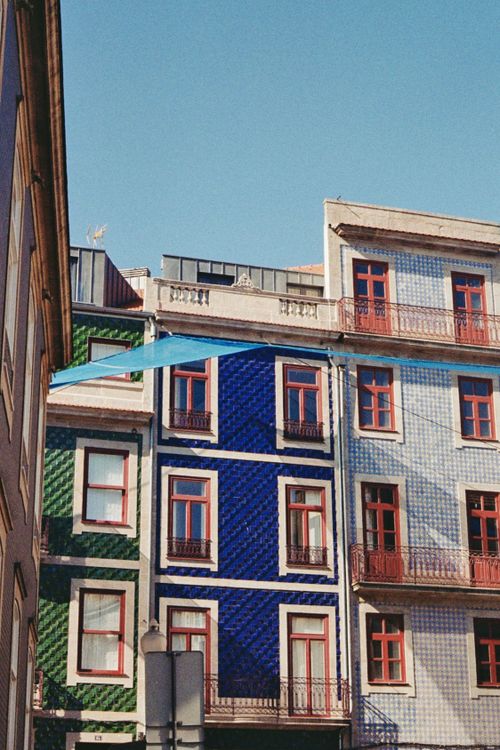 Free Vertical shot capturing the vibrant tiled facades of townhouses in Porto, Portugal. Stock Photo