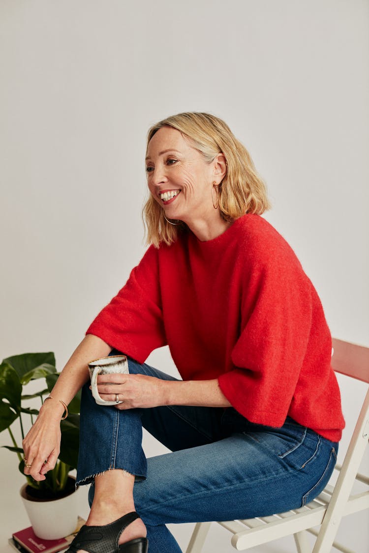 Smiling Woman Holding A Mug