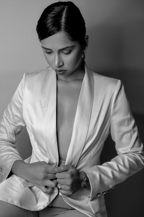 Black and White Photo of a Young Woman in Elegant Silk Blazer