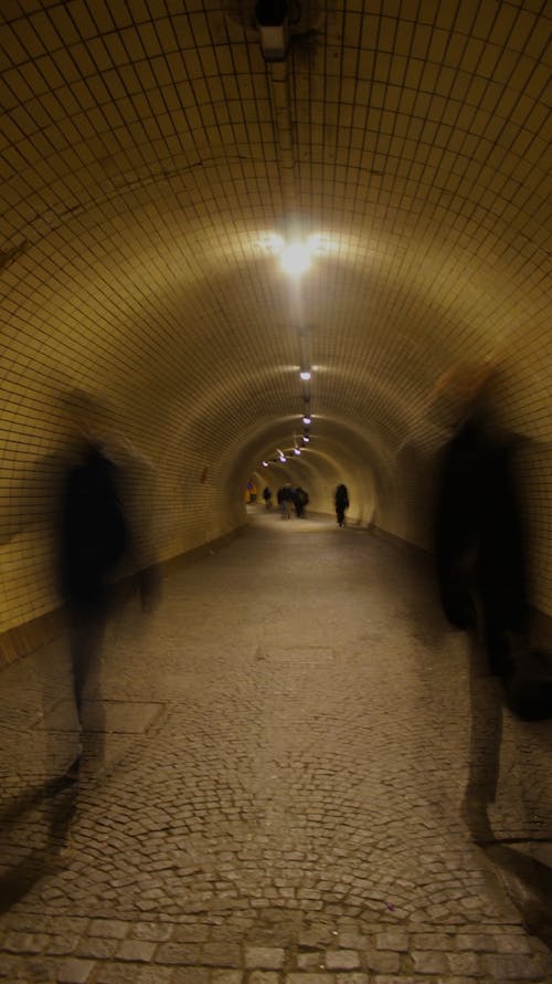 Blurry Picture of People Walking in the Tunnel 