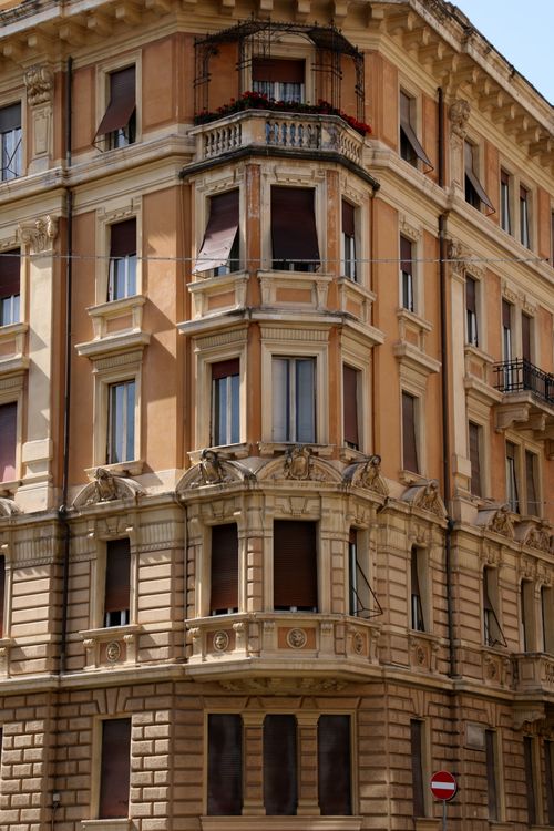 Free View of a classic Roman building facade with balconies and windows under daylight. Stock Photo