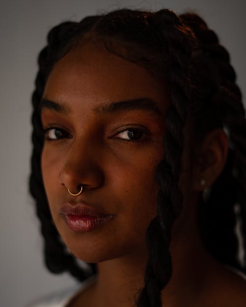 Close-up Portrait of a Young Woman with Braided Hair