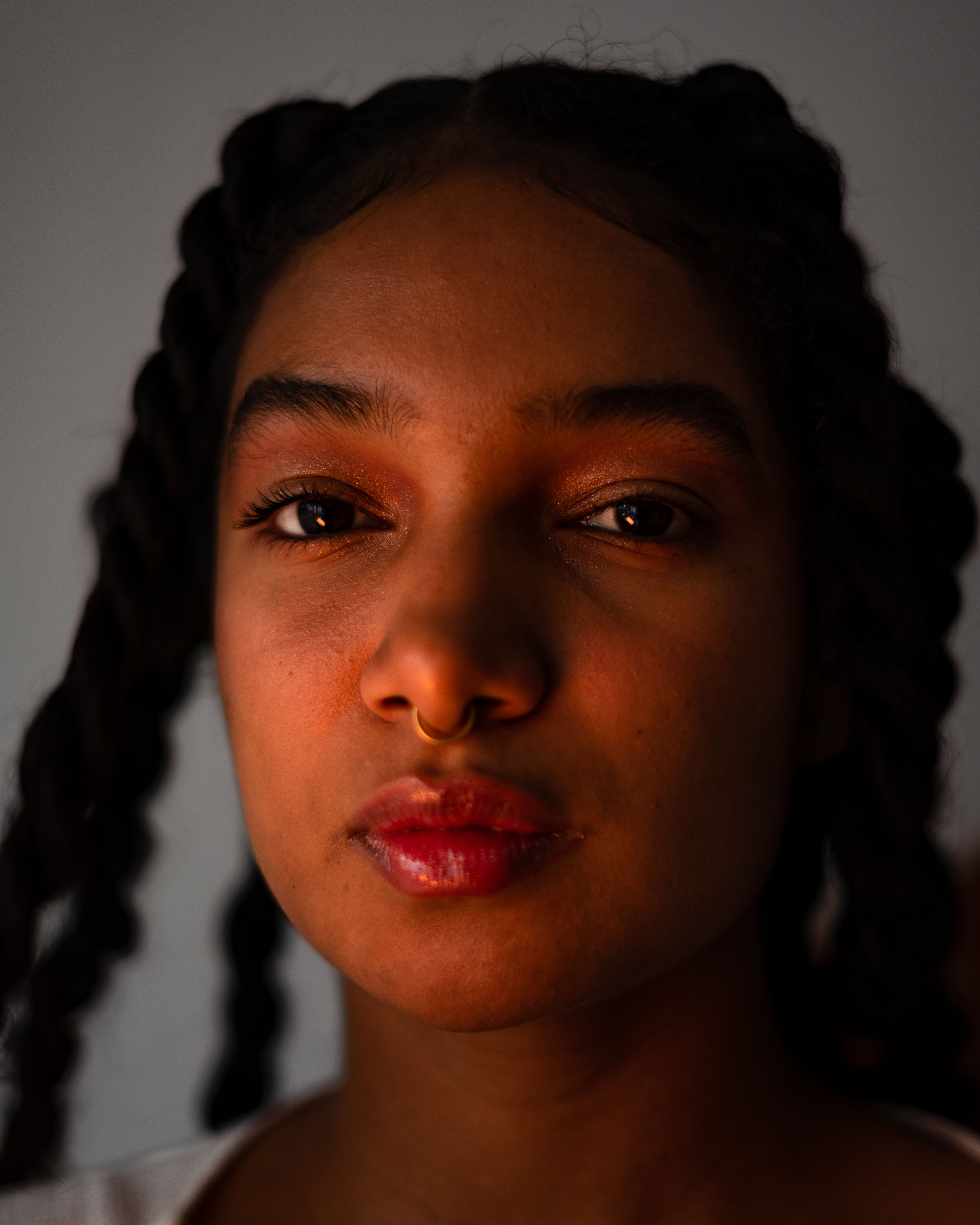 Close-up Portrait of a Young Woman with Braided Hair · Free Stock Photo