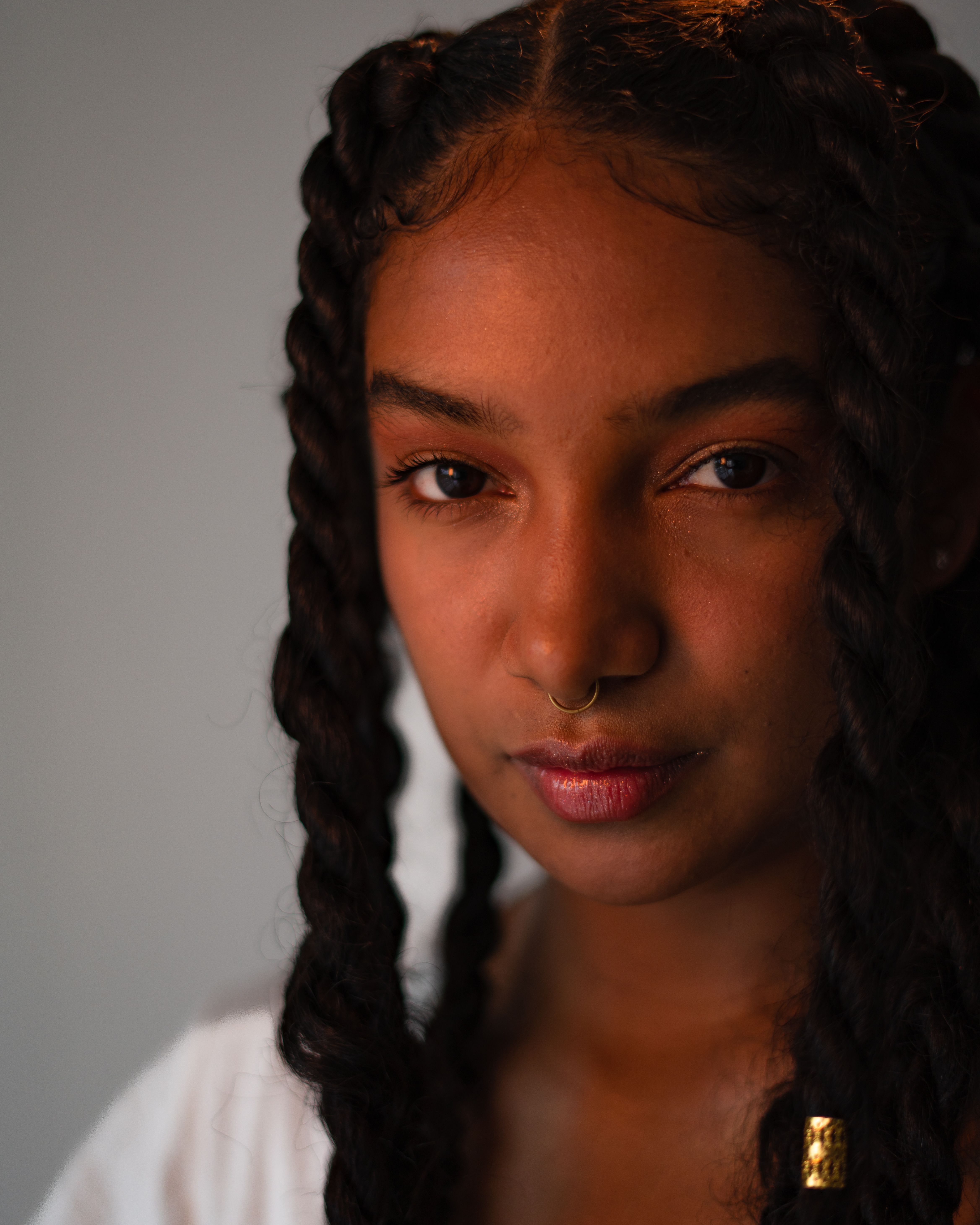 Close-up Portrait of a Young Woman with Braided Hair · Free Stock Photo