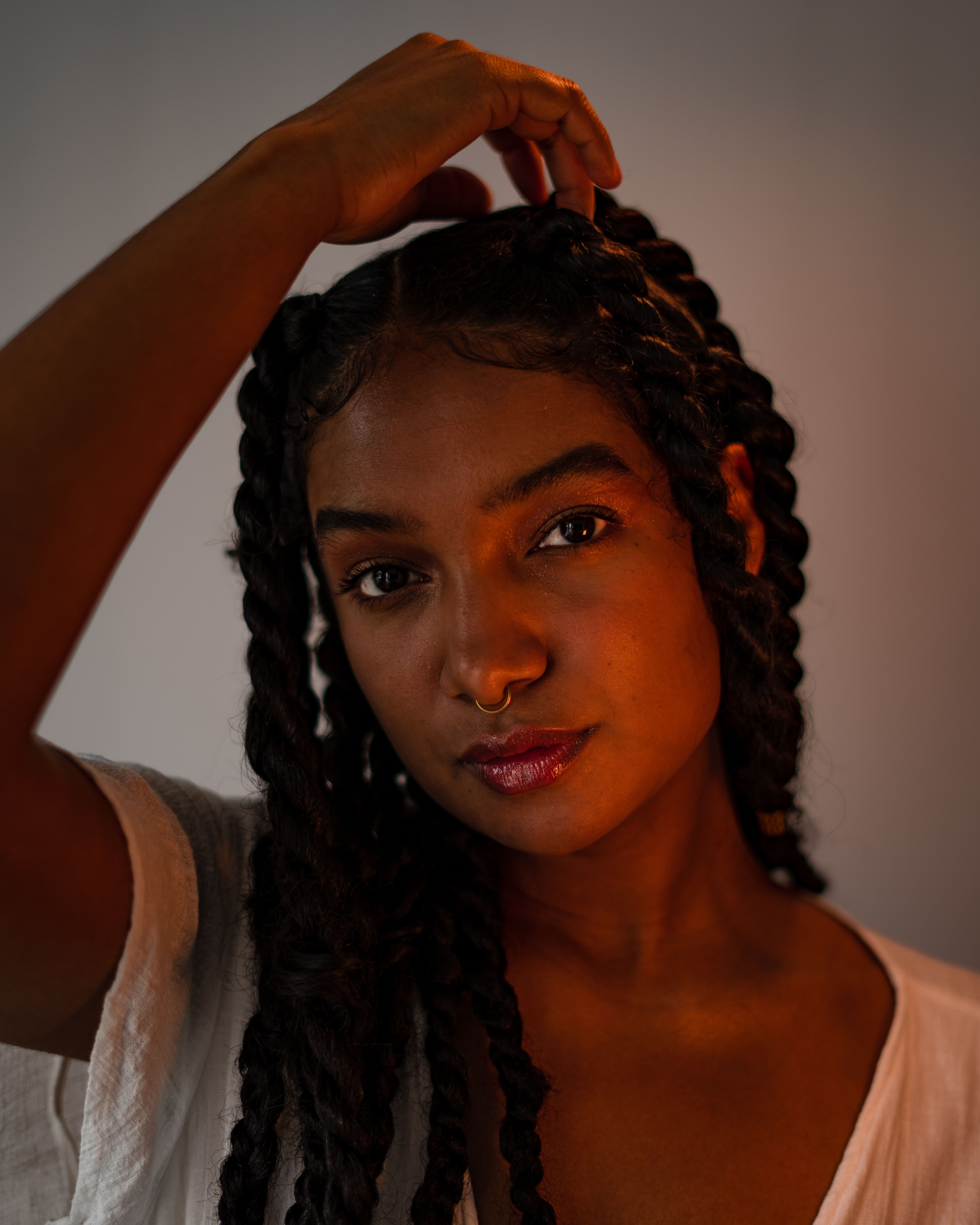Portrait of a Young Woman with Braided Hair · Free Stock Photo