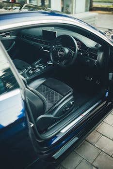 Explore the luxurious interior of an Audi RS5 sports car, showcasing sleek design and comfort.