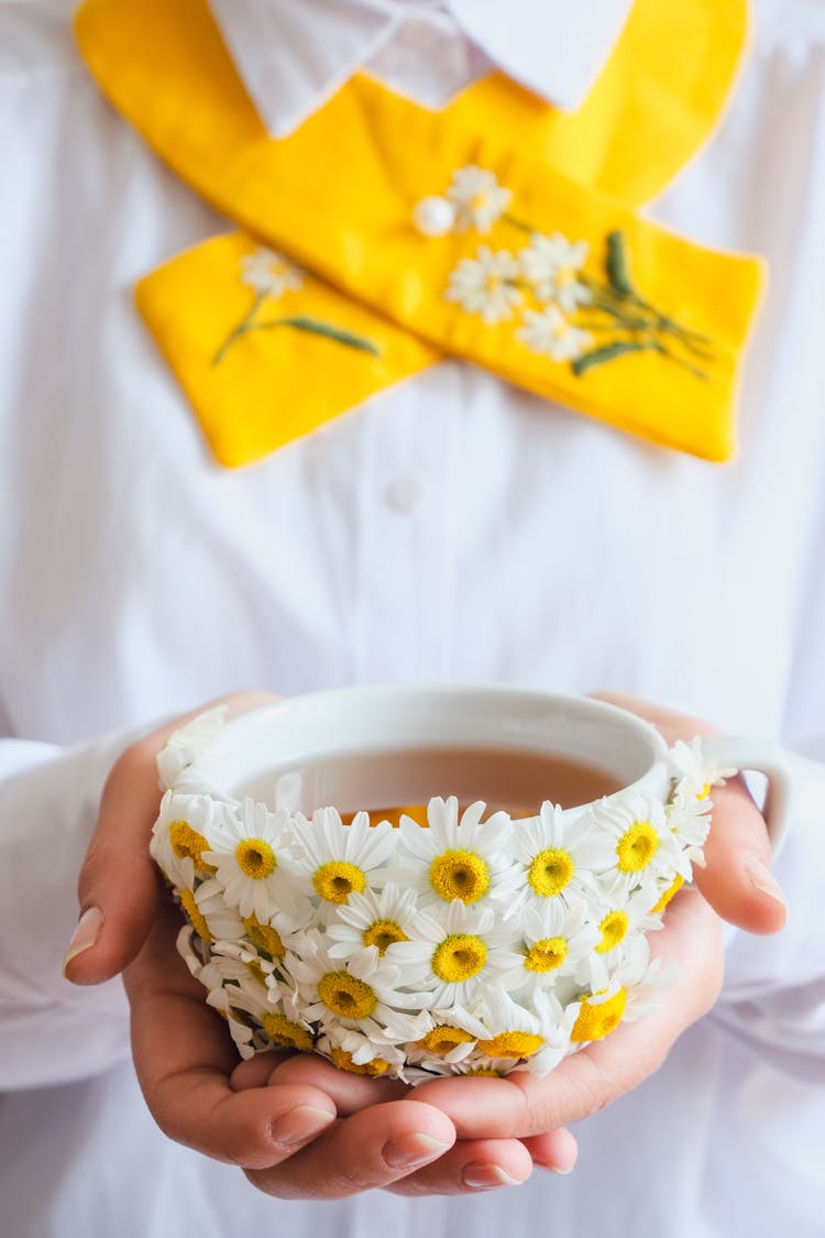 Woman Holding Mug Decorated In Flowers