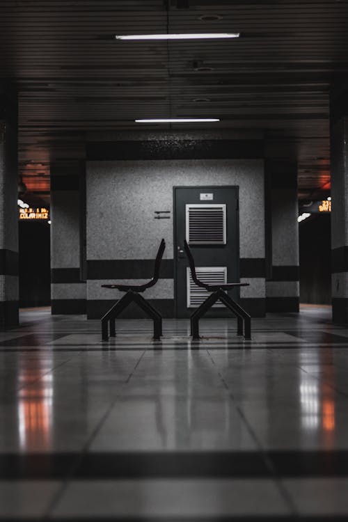 Empty Seats in the Waiting Area of a Station 