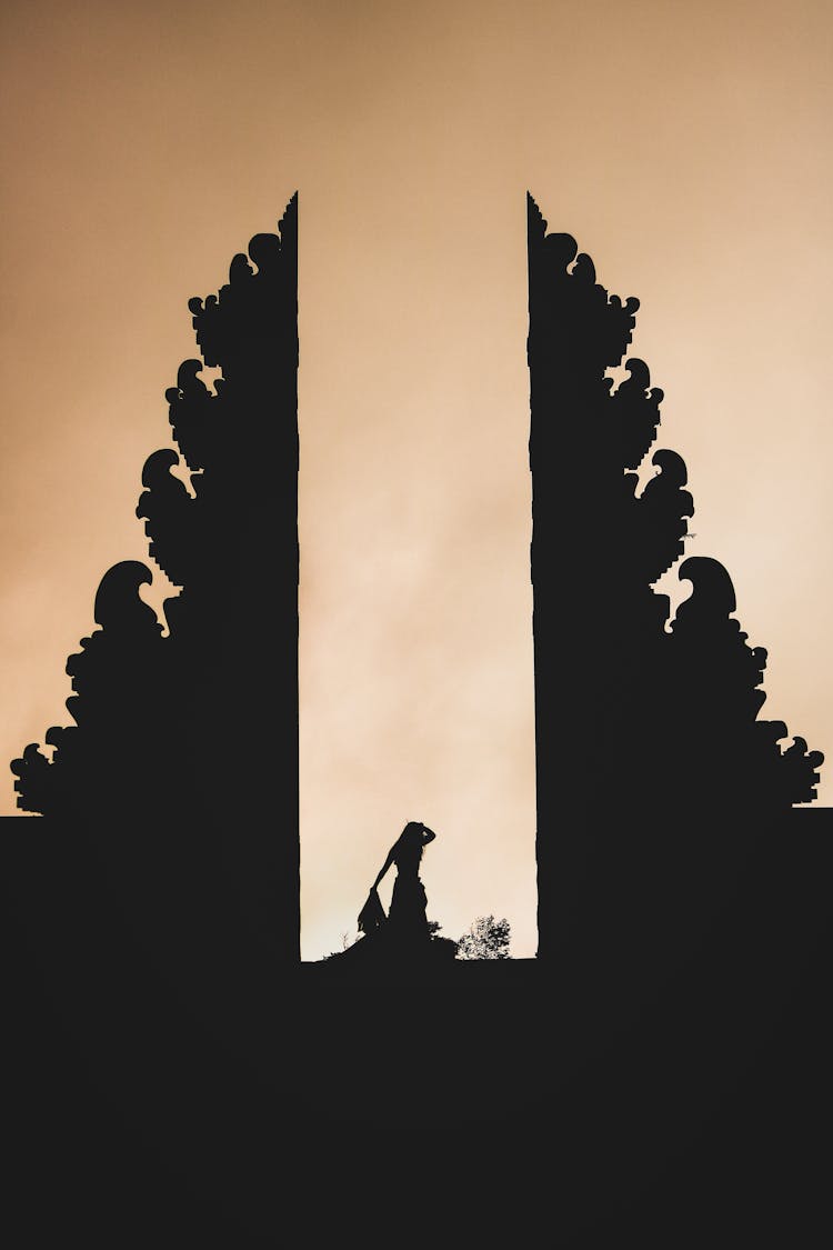 Silhouette Of Person In Balinese Temple