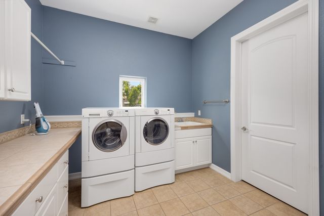 Home laundry room with washing machines similar to units serviced in The Colony, TX