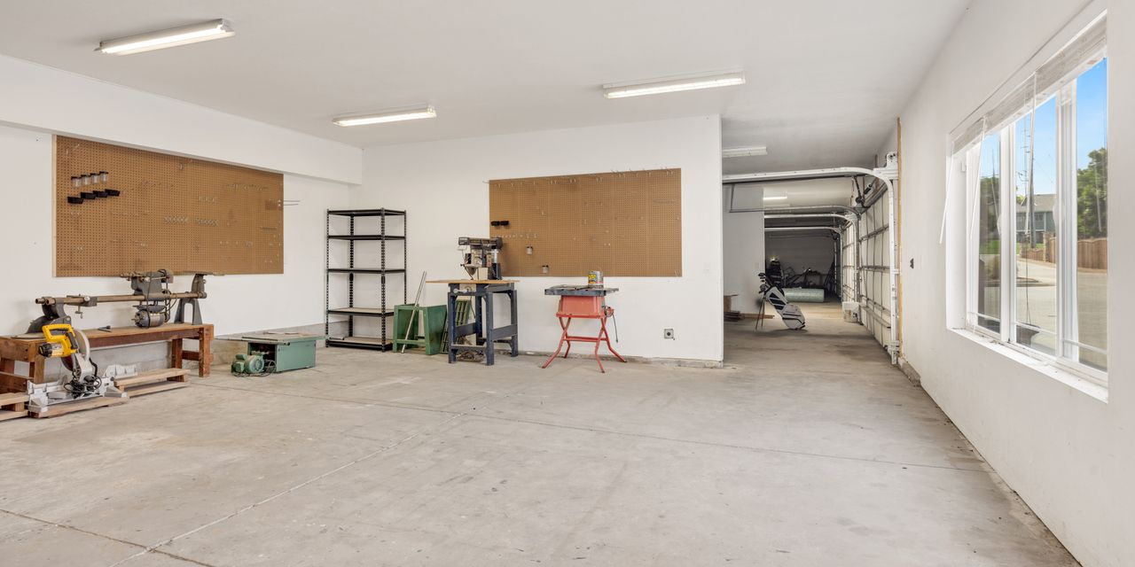 A bright and spacious industrial workshop with machinery and tools.