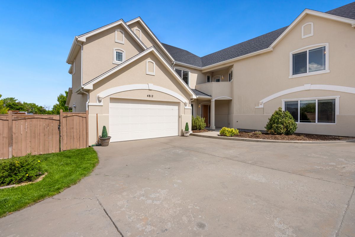 Suburban home exterior with an attached two-car garage and driveway