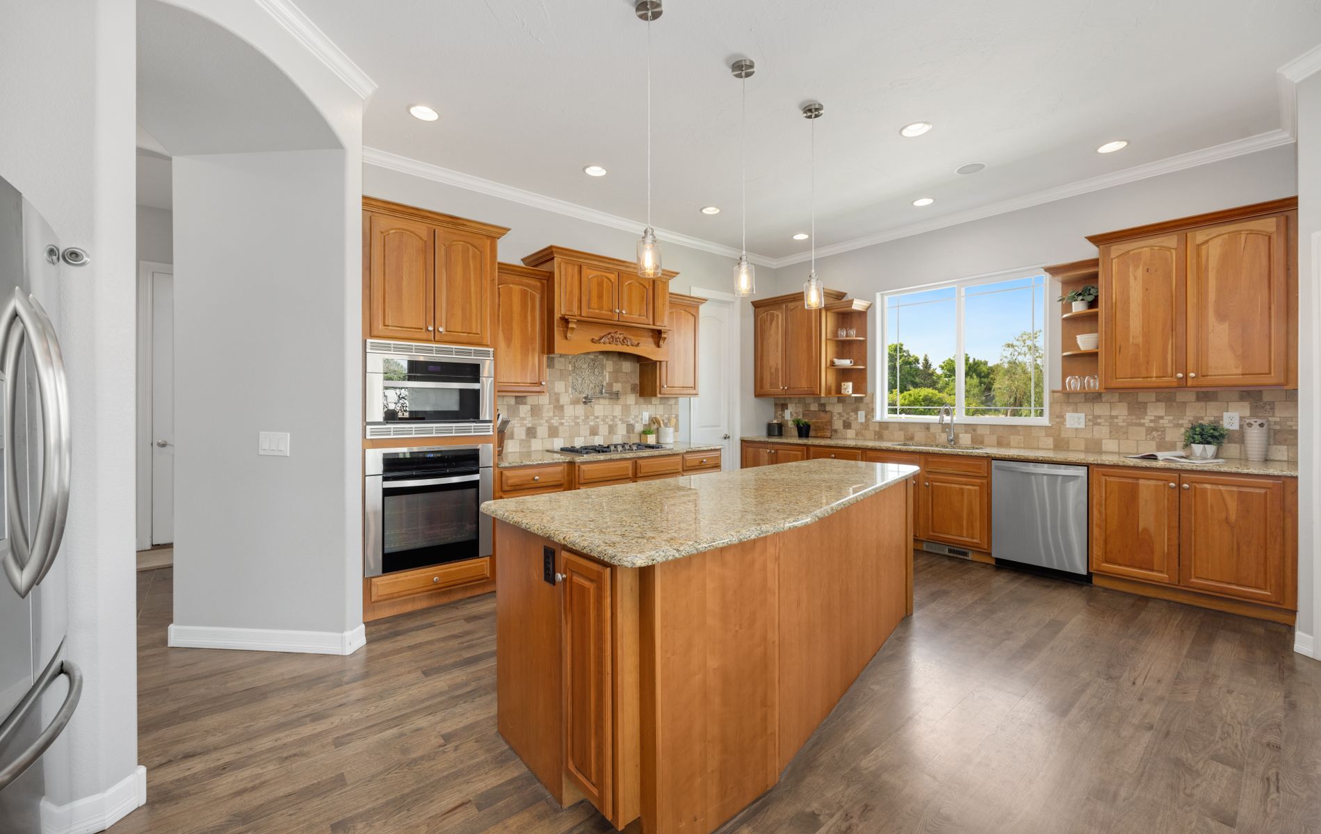 Kitchen flooring installation with tile and wood-look flooring in Orange County