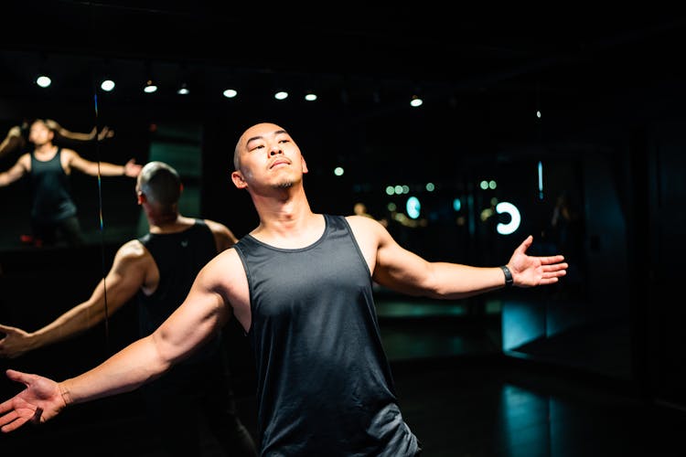 Man In Sportswear Showing Off Muscles