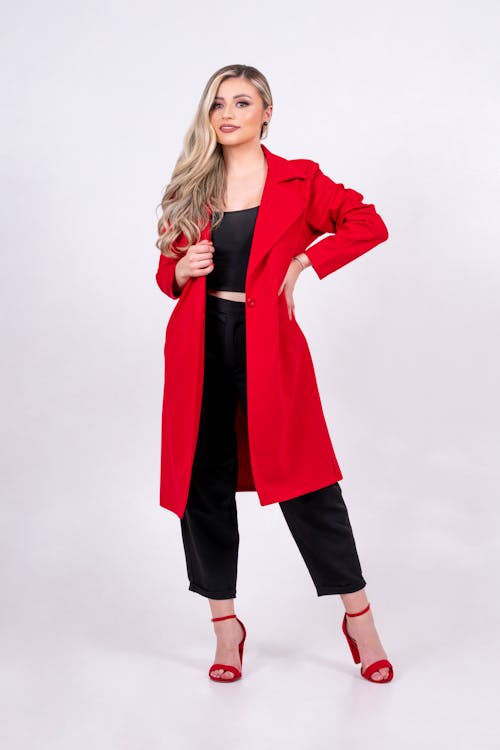 Blonde Beautiful Woman in Red Coat and High Heels