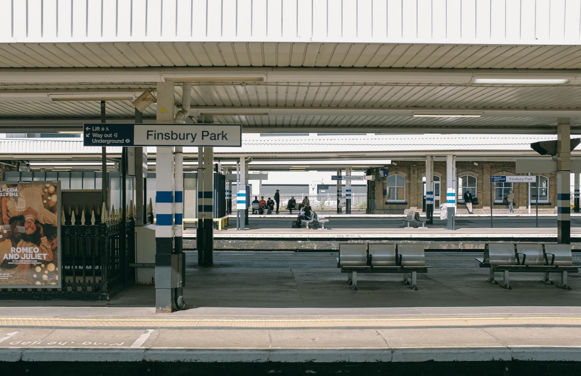 A quiet day at Finsbury Park station with visible signage and seating areas.