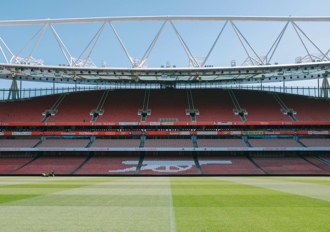 Free A view of the empty stands and football pitch at Emirates Stadium, London, England. Stock Photo