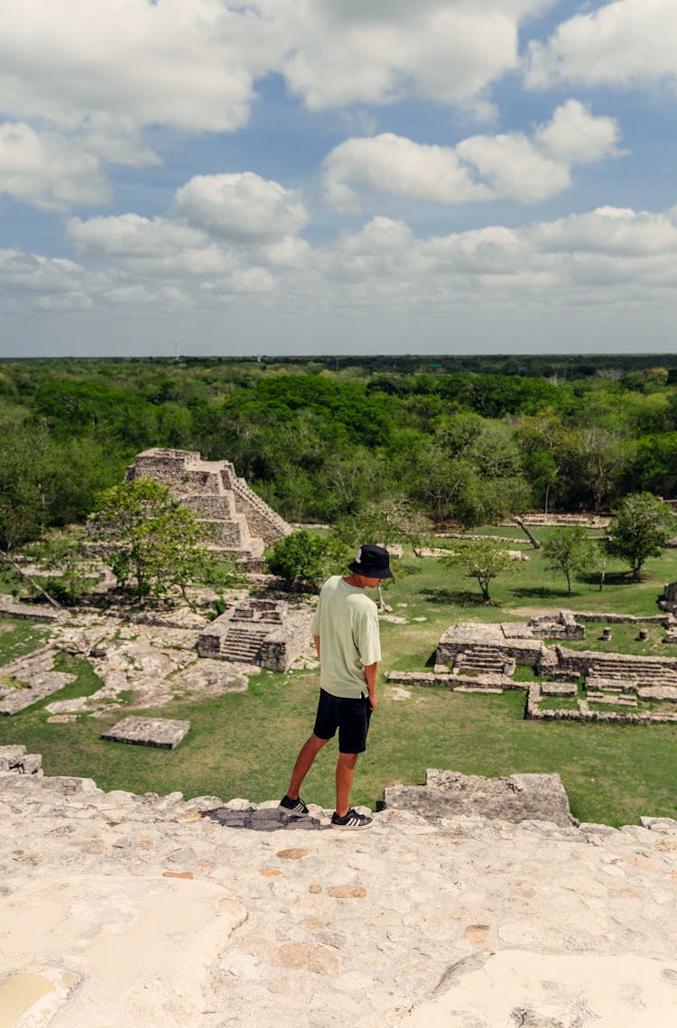 Tourist Standing On Pyramid In Mayapan In Mexico