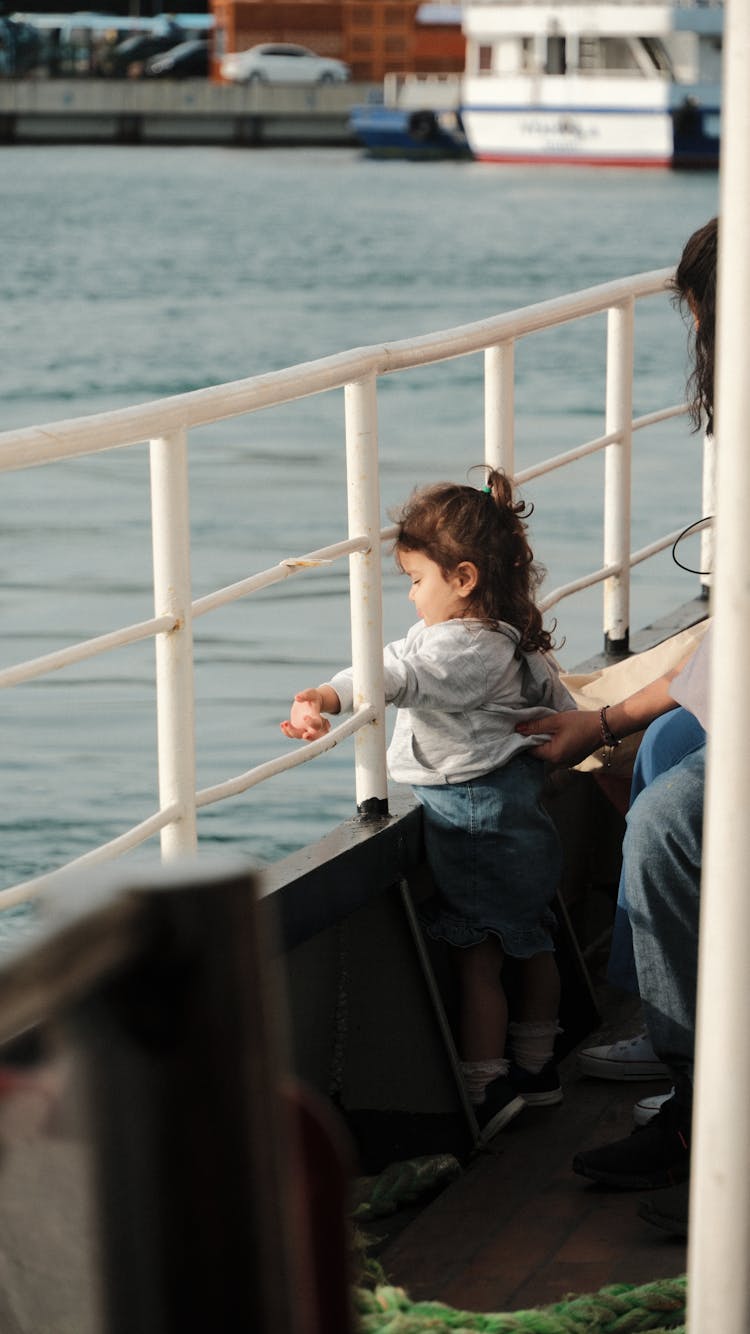 Girl Travelling On A Cruise Ship Looking At Sea 