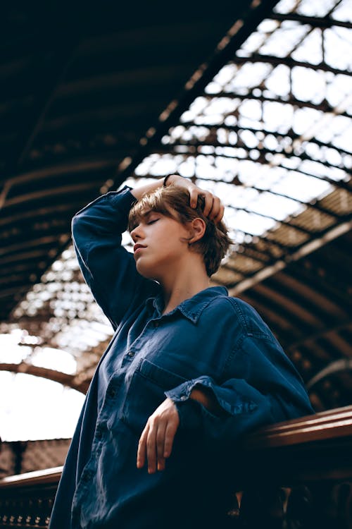 Photo of Woman Leaning on Railings