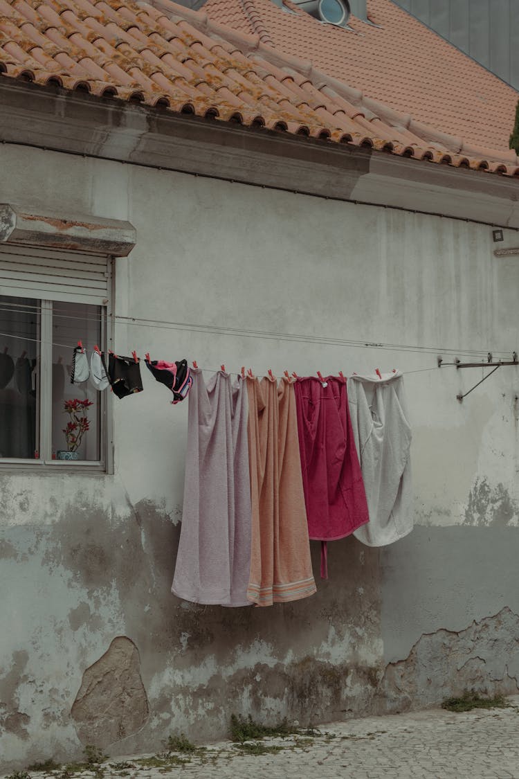 Laundry Hanging On Rope In House Yard