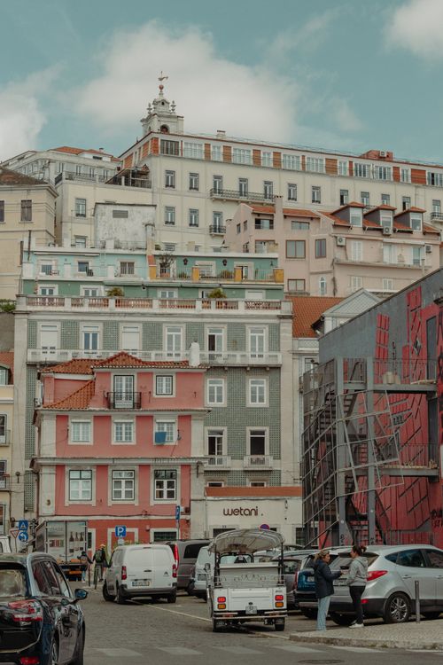 Free Vibrant eclectic buildings and street scene in Lisbon, capturing urban life. Stock Photo