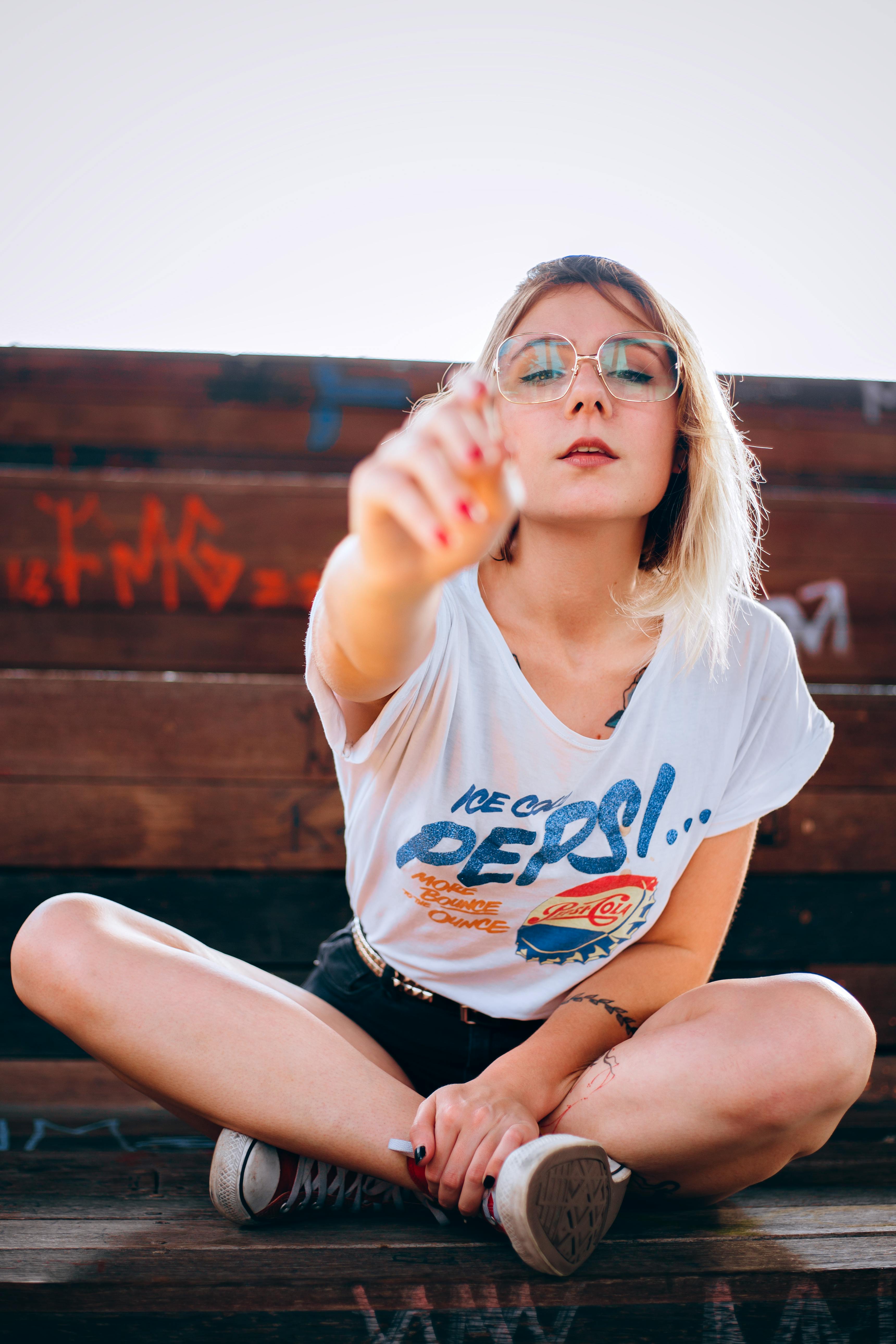 Free Photo of Woman Sitting on Wooden Bench Stock Photo