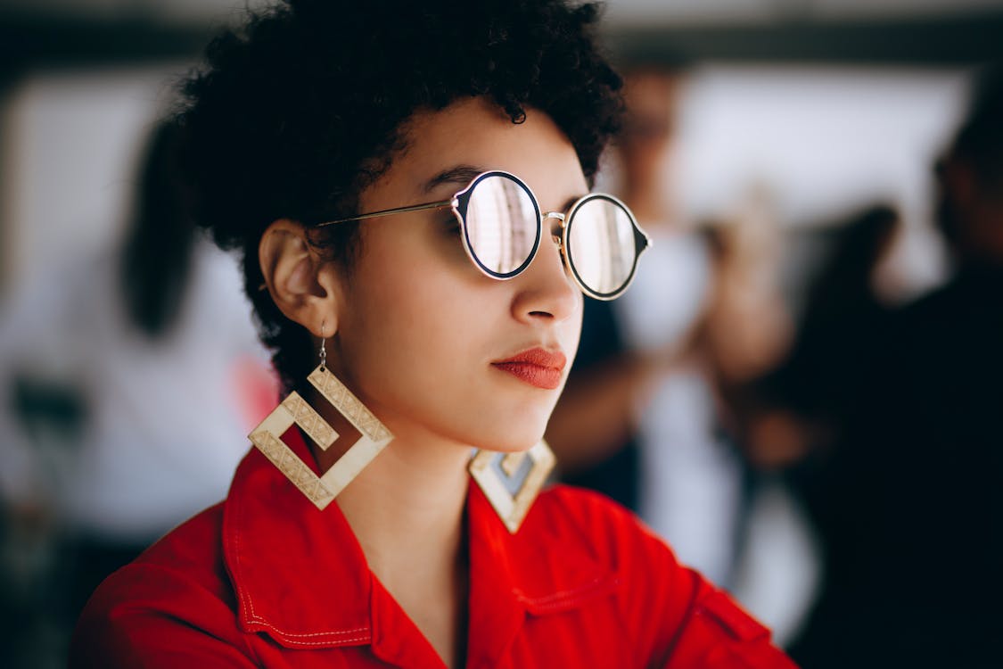 Woman in Silver Framed Eyeglasses and Red Top