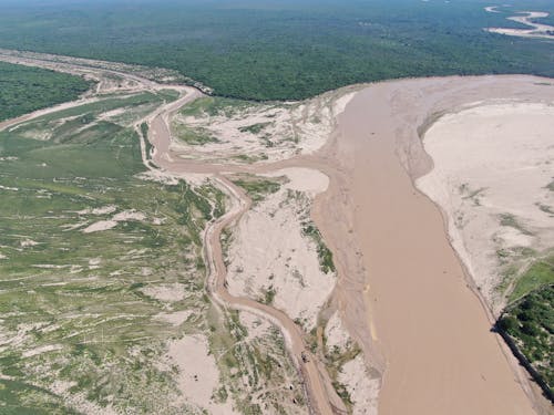 Drone Shot of River on Sunlit Plains