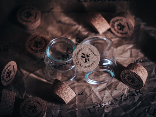 Close-up of Empty Glass Containers with Cork Lids