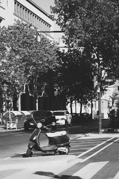 Motor Scooter Standing in Urban Parking Lot