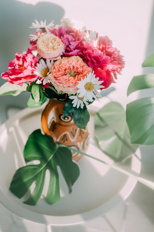 Flowers in a Vase on a Table 