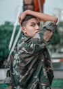 Photo of Boy Wearing Camouflage Jacket