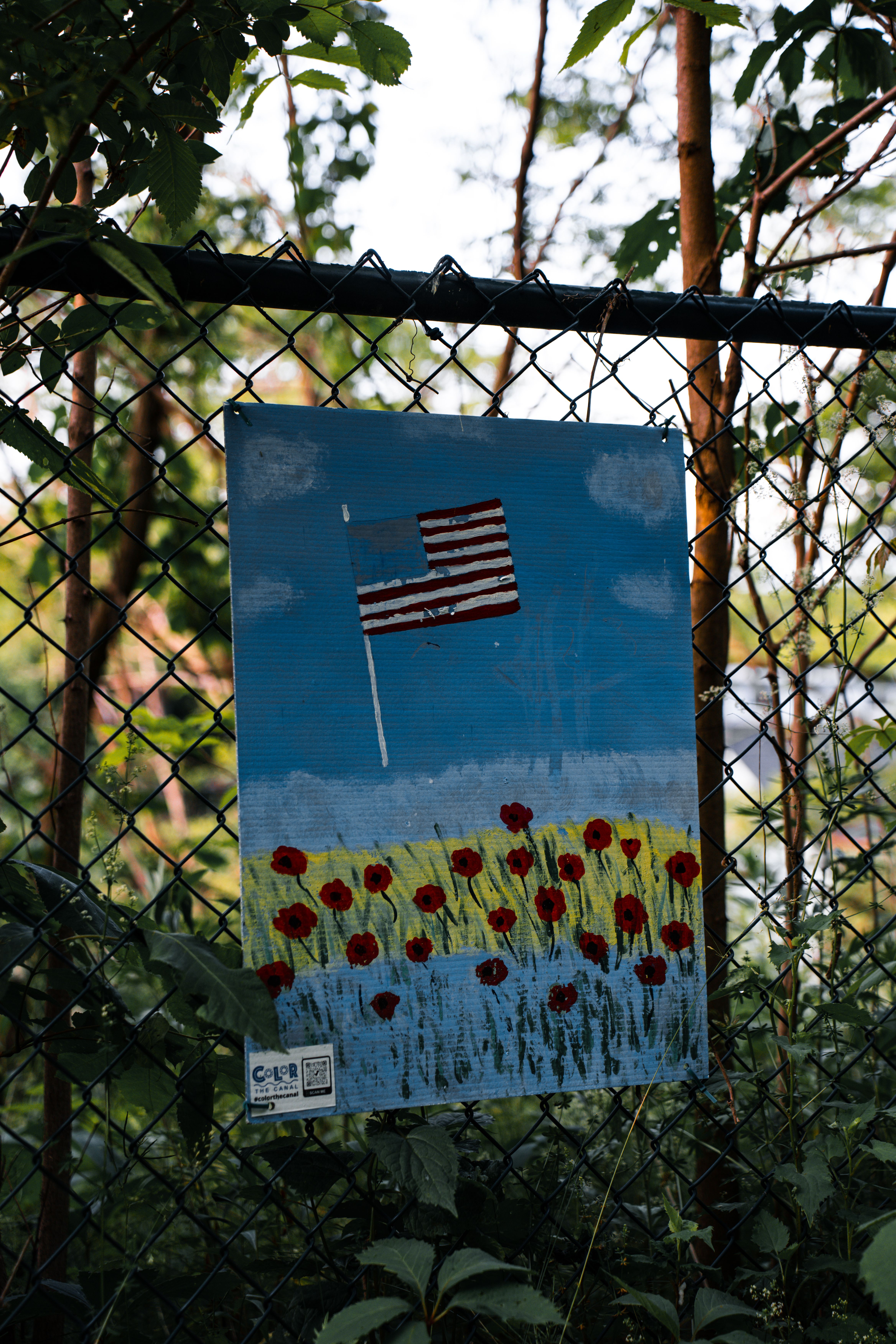 Painting of American Flag Hanging on Mesh Fence · Free Stock Photo
