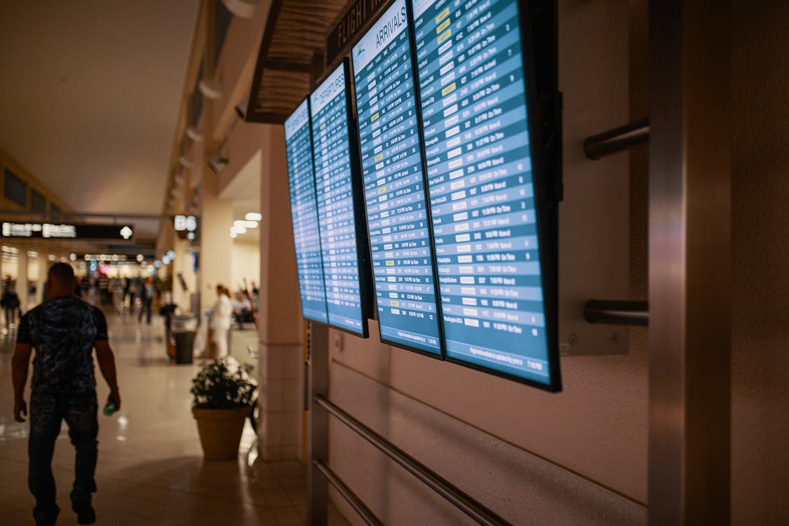 Free Airline Flight Schedules on Flat screen Televisions Stock Photo