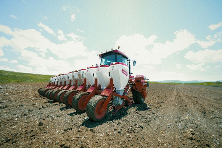 Tractor With Machine On Field