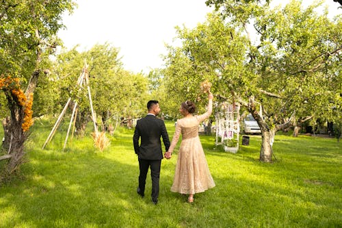 Couple Walking in Orchard