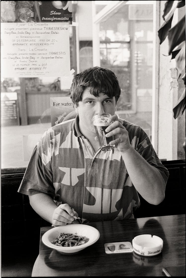 Man In Shirt Having Breakfast In Restaurant