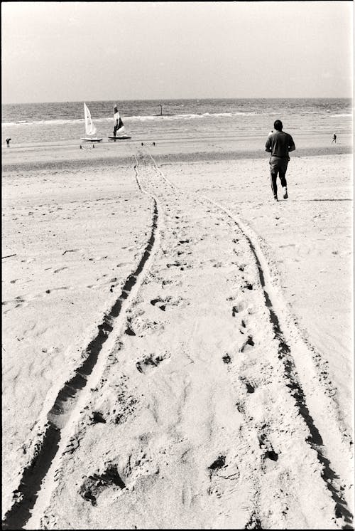 Wheel Tracks and Footsteps on Beach