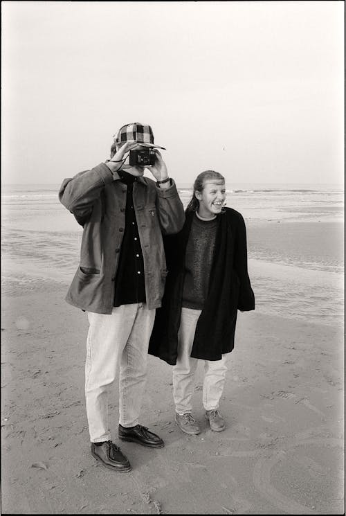 Photographer and Happy Woman on Beach