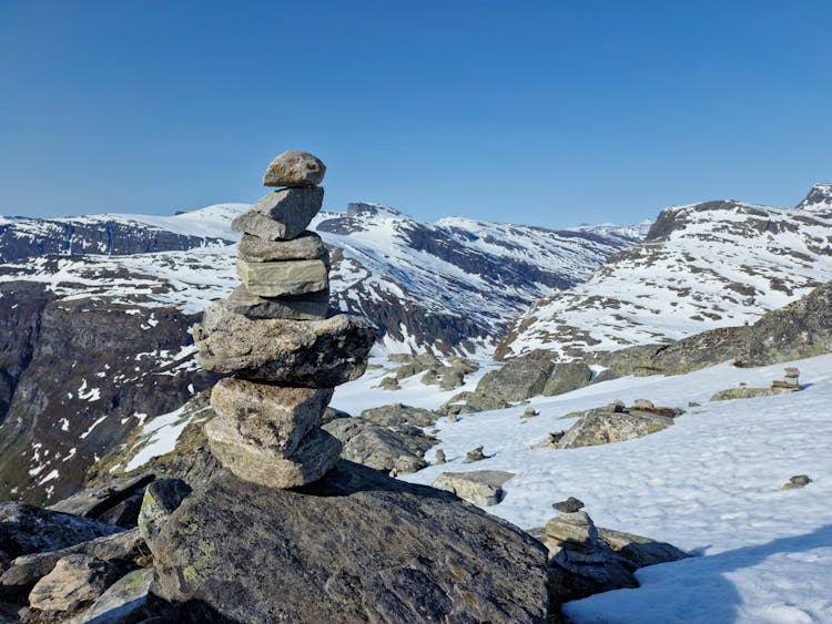 A Pile Of Stones On A Mountain Peak 