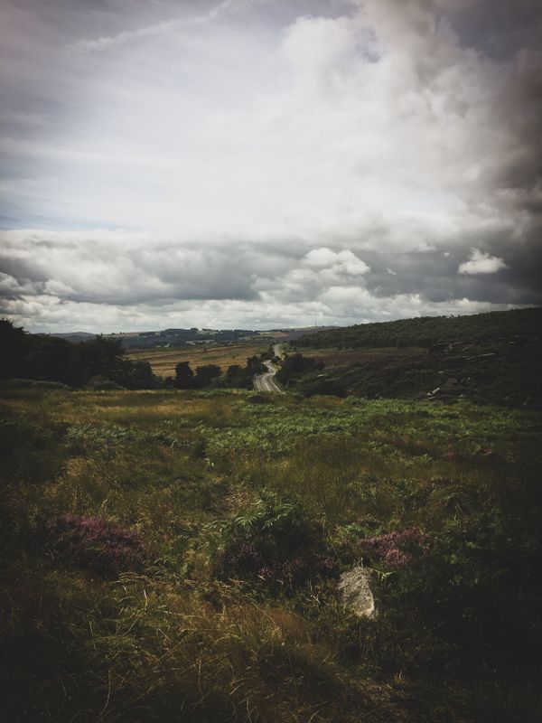 Low cloud over moorland hills — photo by Sam J on Pexels